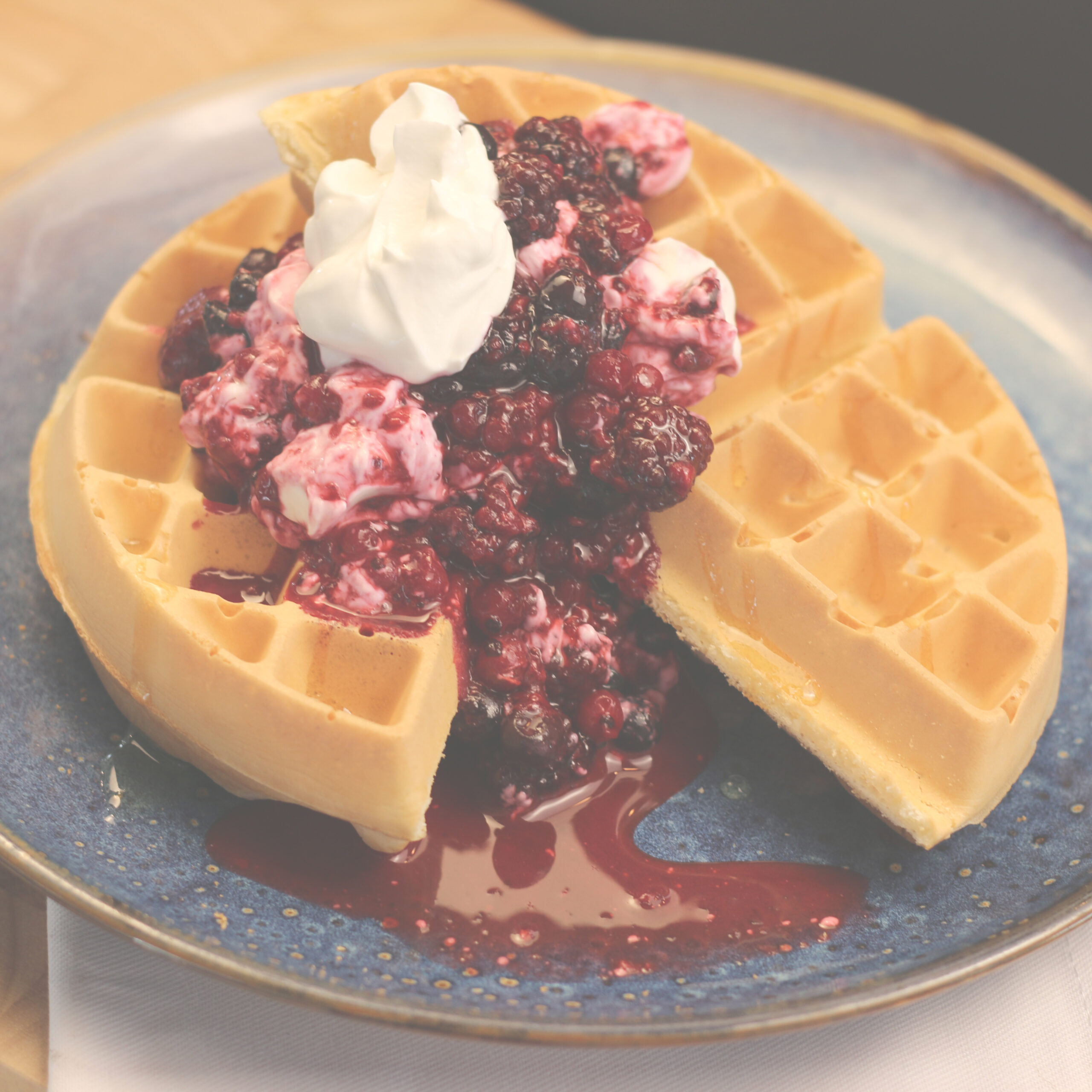 Berry compote waffle with yoghurt and honey