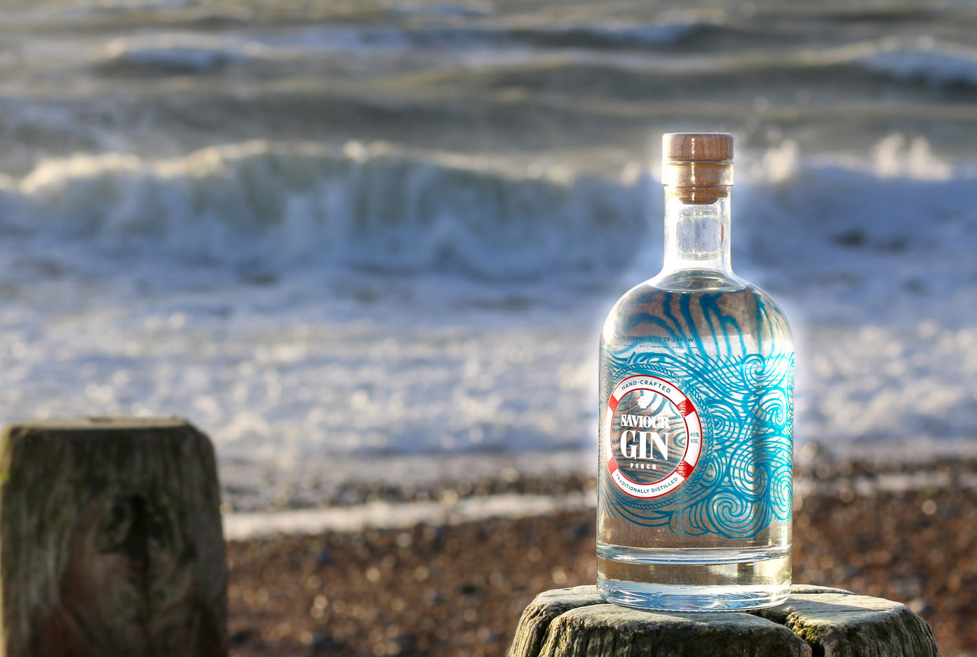 Bottle of Saviour gin on Lancing Beach