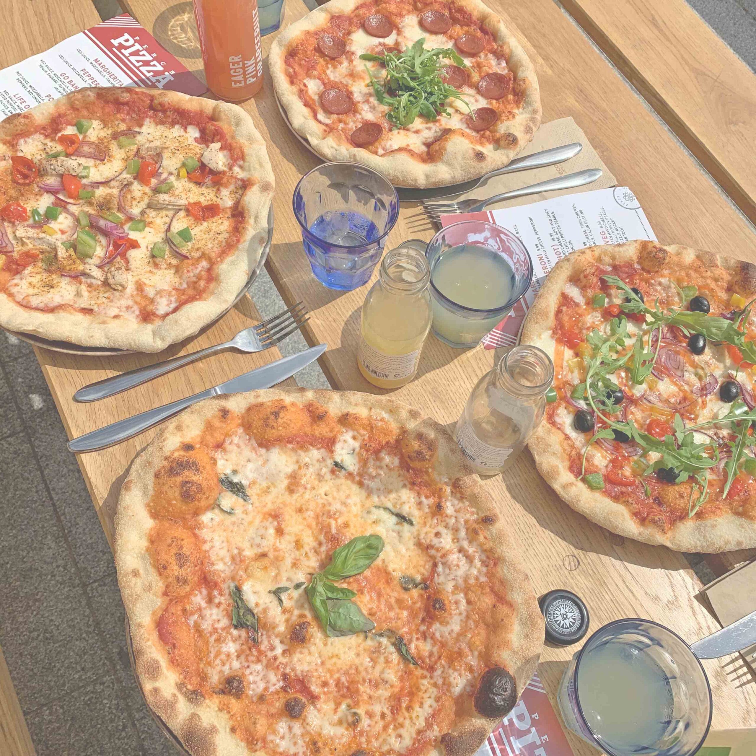 Hand stretched pizza cooked in outdoor pizza oven every day from 12pm